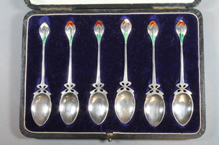 A set of 6 silver Art Nouveau and enamelled coffee spoons in the form of flower heads, Birmingham 1905, makers mark William  Hair Haseler, some enamel damaged to spoons, cased, 2 ozs   ILLUSTRATED