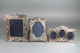 A modern embossed silver Art Nouveau style easel photograph  frame 8" x 7", a Victorian style do. 7" x 5" and an oval silver  framed triple photograph frame 4" x 7.5"