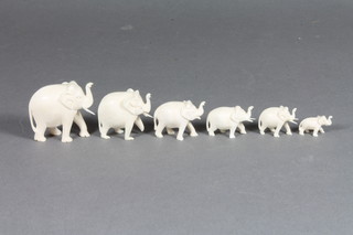 2 carved ivory figures of elephants 1" and 1.5" and 4 other  carved ivory figures of elephants