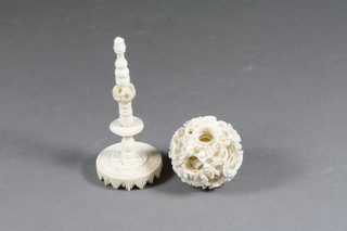 A carved ivory puzzle ball 1" complete with stand - f, 1"