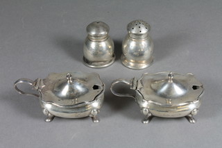 A pair of silver mustard pots with hinged lids, a silver salt and  pepper and a silver napkin ring, 4 ozs