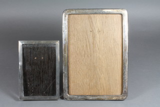 A plain silver easel photograph frame Birmingham 1925 8.5" x 6" together with 1 other silver coloured photograph frame 5.5" x  4"