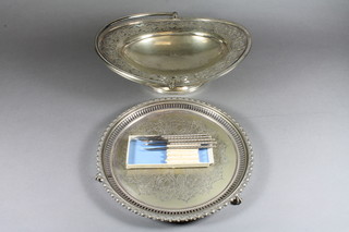 A pierced silver plated cake basket with swing handle 12", do.  salver with bracketed border 10" and a set of nut picks