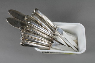 An Art Deco silver handled button hook and do. shoe horn  together with 12 silver handled tea knives
