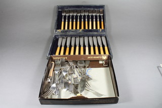 A set of 11 silver plated fish knives and forks, cased together with a small collection of silver plated flatware