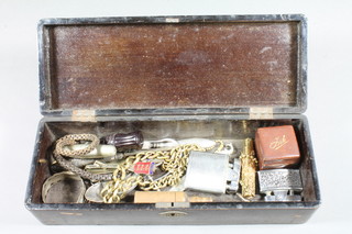 A rectangular lacquered glove box containing a collection of  curios, costume jewellery etc