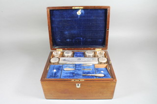 A Victorian rectangular rosewood vanity box with hinged lid  fitted 5 glass bottles with silver plated lids etc