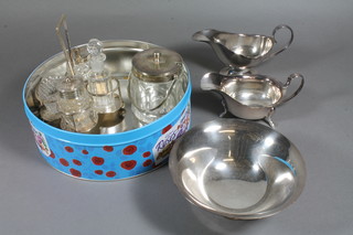 A silver plated 4 piece condiment set, a glass and silver plated mounted preserve jar, 2 plated sauce boats etc