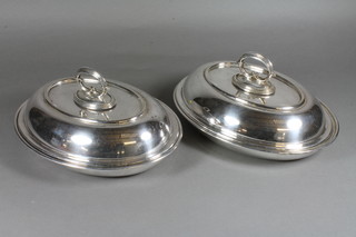 A pair of oval silver plated entree dishes and covers 11"