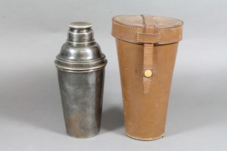 A silver plated cocktail shaker and 6 beakers contained in a  leather travelling case