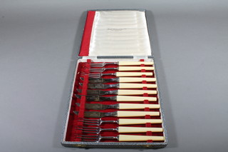 A set of 6 fruit knives and forks by Joseph Rogers