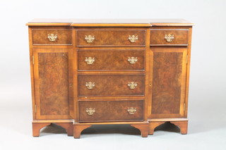 A Georgian style figured walnut dwarf breakfront sideboard with crossbanded top, fitted 4 long drawers with brass swan neck drop  handles, flanked by a pair of cupboards, on bracket feet 30"h x  42"w x 13"d