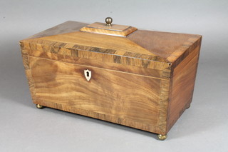 A Victorian mahogany and crossbanded rosewood sarcophagus  shaped tea caddy with hinged lid and brass shield shaped escutcheon, raised on bun feet 6"h x 11"w x 5"d