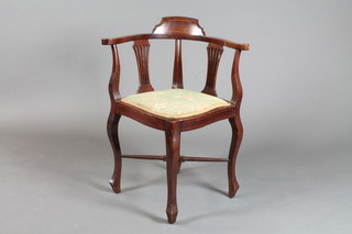 A Victorian inlaid mahogany corner chair with pierced splat back and upholstered seat with X framed stretcher, raised on cabriole  supports