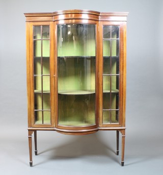 An Edwardian inlaid mahogany display cabinet, fitted shelves enclosed by a bow front panelled door with astragal glazed panels  to the side, raised on square tapering supports, spade feet 63"h x  41" x 17"d  ILLUSTRATED