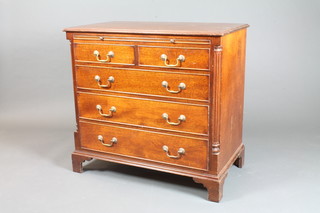 A George III style mahogany chest with brushing slide, fitted 2 short and 3 long drawers with brass swan neck drop handles,  flanked by pilasters, on bracket feet 33"h x 35"w x 20"d