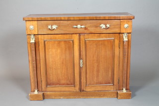 A Regency mahogany chiffonier with brass inlaid top, fitted 1 long drawer above a cupboard enclosed by panelled doors having  Egyptian style pilasters to the side 33.5"h x 41.5"w x 13"d   ILLUSTRATED