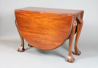 A Chippendale style mahogany drop flap dining table with gadrooned border, raised on ball and claw supports 30"h x  41.5"l x 18"w