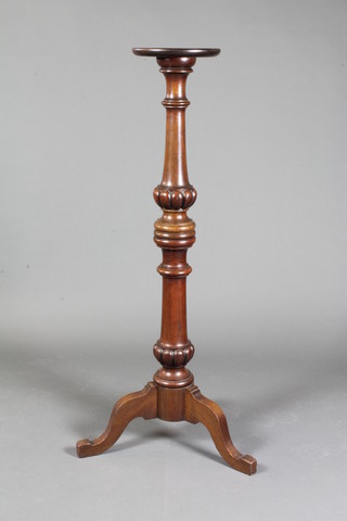 A Victorian turned mahogany torchere raised on tripod supports  47"h x 9"w