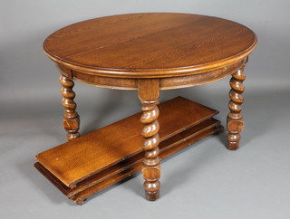 An early 20th Century oak D end dining table on barley twist legs and casters, 31"h x 48"diam. x 95"l