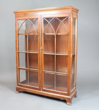 A Georgian style mahogany display cabinet with crossbanded top, fitted adjustable shelves enclosed by astragal glazed panelled  doors, raised on ogee bracket feet 55"h x 39"w x 13"d