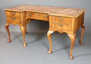 A Queen Anne style inverted breakfront walnut writing table with  brown inset skiver, fitted 1 long and 2 short drawers, raised on  cabriole supports 30"h x 60"w x 27.5"d   ILLUSTRATED