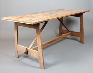 In the style of William Morris, an Arts and Crafts oak trestle refectory dining table with H framed stretcher 29"h x 70"l x 30w   ILLUSTRATED