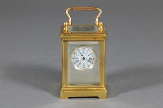 A 20th Century gilt brass corniche cased miniature carriage timepiece, having Roman and Arabic enamelled dial, the cylinder  movement with lever escapement 3"h x 1.5"w x 1.25"d