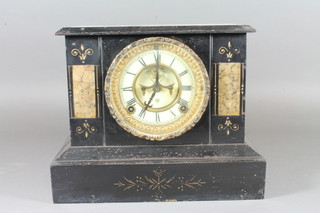 An American 8 day striking mantel clock with visible escapement, Roman numerals by Ansonia contained in an iron  architectural case