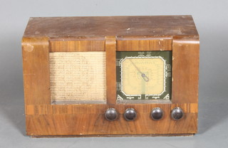 A Regentone radio contained in a walnut case