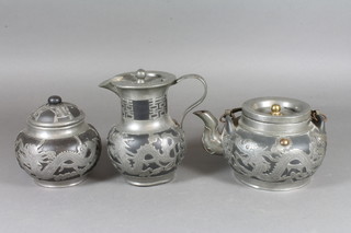A Chinese black terracotta and pewter mounted teapot 7", the base with seal mark, do. sugar bowl and jug decorated dragons