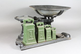 A pair of cast iron domestic pan scales complete with weights