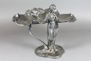 An Art Nouveau WMF table centre piece in the form of a  standing girl with dove, the base marked OX WMF P246 9"