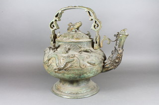 A Chinese bronze teapot with swing handle, decorated dragons  12"