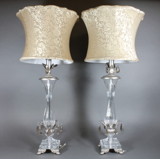 A pair of glass and silvered club shaped table lamps on square bases 14"