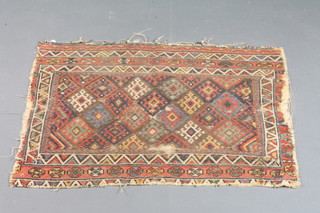 A Caucasian rug with geometric design to the centre 36" x 26.5", some wear