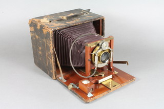 A 19th/20th Century bellows plate camera marked Montauk 11A, lens marked Unicum