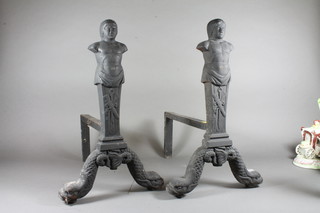 A pair of 19th Century iron fire dogs in the form of classical figures complete with grate