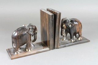 A pair of coromandel book ends in the form of elephants 6"h x  7"w x 3"d
