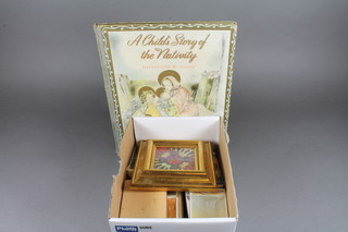 Reed Raymond, 1 volume "A Child's Story of the Nativity", a  leather bound writing set, various playing cards and an  embroidered badge decorated an eagle