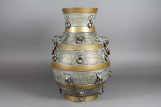 A Chinese bronze vase of baluster form with drop ring handle  decoration, the base with seal mark 12.5"h