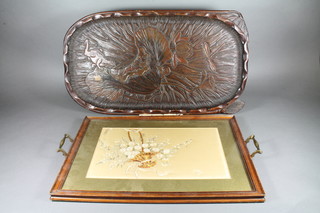 An Art Nouveau Japanese style carved wooden tray decorated a  toad on a lily pad 24" and a twin handled tray 24" x 13" and 1  other with tapestry panel 19" x 13"