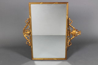 In the manner of Robert Adam, an early 20th Century carved gilt wood wall mirror, having an urn finial flanked by bell flowers,  reeded frame and surmounted by a rams head mask 30"h x  31.5"w