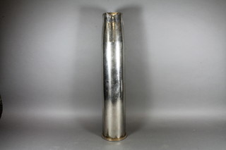 A chrome plated 90mm shell case dated 1962