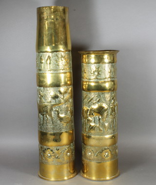 A "Trench Art" brass shell formed from a 105mm shell dated  1968 together with a 105mm shell dated 1969