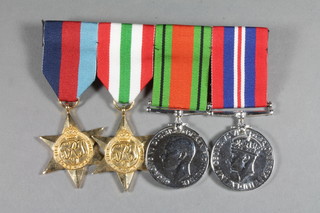 A group of 4 facsimile WWII medals comprising 1939-45 Star,  Italy Star, Defence and War medal