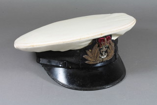 A Royal Navy Officer's cap by Army & Navy Hat & Cap Ltd.