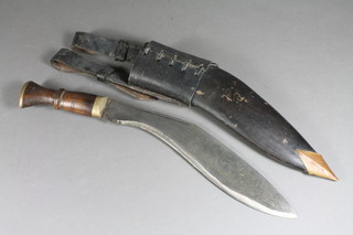 A Kukri with 11" blade complete with leather scabbard