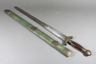 An Eastern double bladed sword with 20" blade contained in a  shagreen finished scabbard