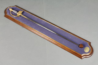 A reproduction 18th Century court sword with 30" double edged  blade complete with wall mount